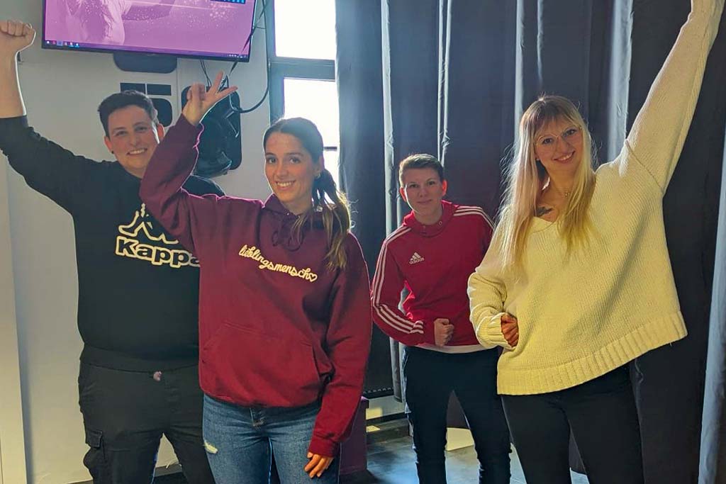 Success at Escape Hannover, team celebrating after the solved puzzle in the VR escape room